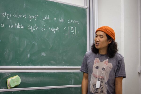 Tony Huynh gave a talk at the Discrete Math Seminar on the conjecture of Ahranoi on the existence of a short rainbow cycle
