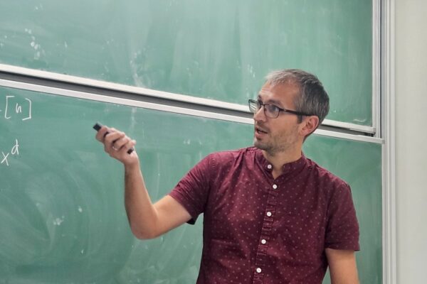 Péter Pál Pach gave a talk on the maximum set of positive integers that avoids having any product of k elements equal to a d-th power at the Discrete Math Seminar