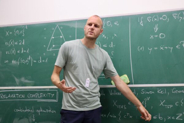 Stefan Weltge gave a talk on the minimum number of inequalities whose integer solutions are standard unit vectors at the Discrete Math Seminar